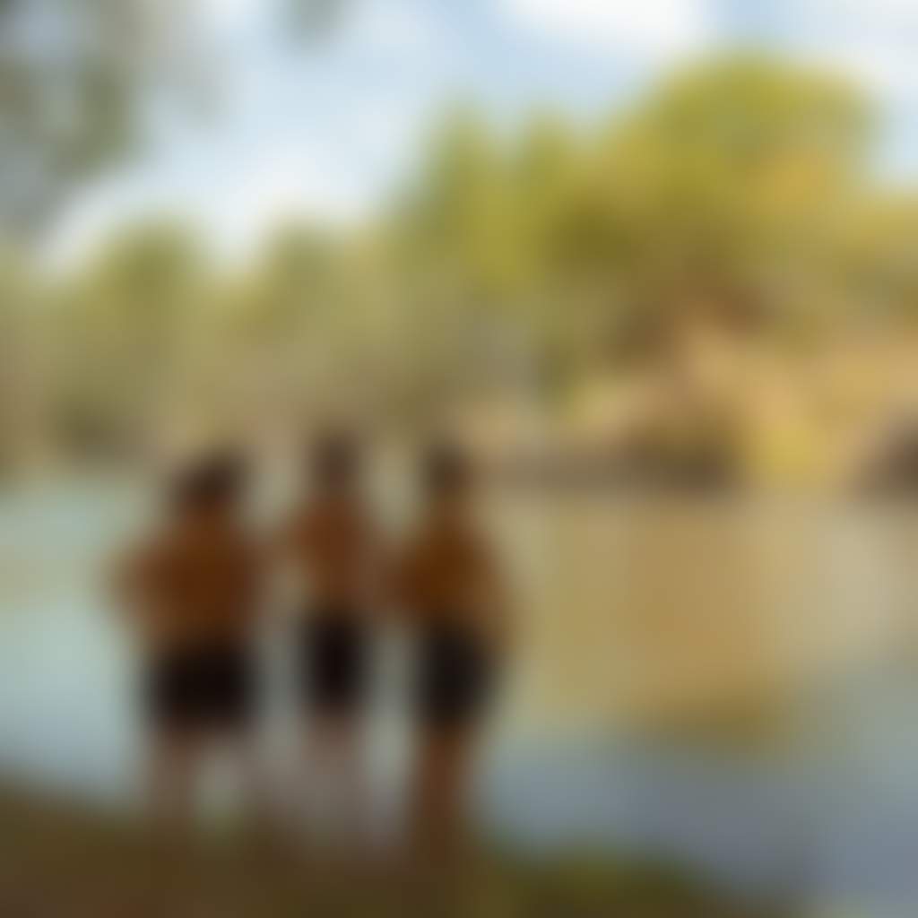 Boys swimming on riverbank in Corowa