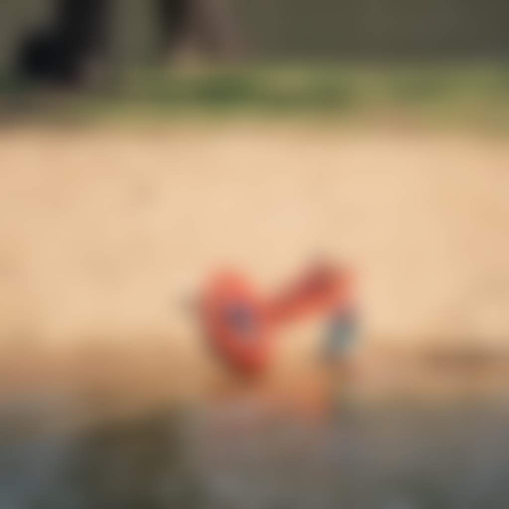 A child sitting by kayaks on the riverbank at Corowa Howlong