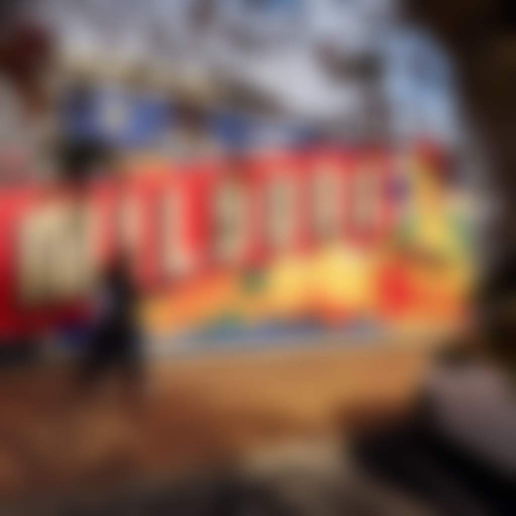 Pedestrians walking past the Mildura street art mural